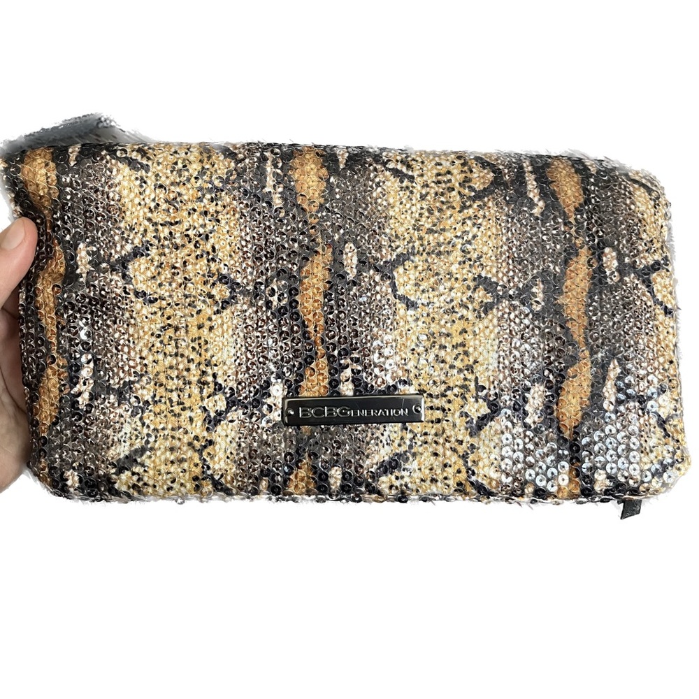 BCBGmaxazria White Glossy Sequined Styled Lazy Clutch in Animal Print Background